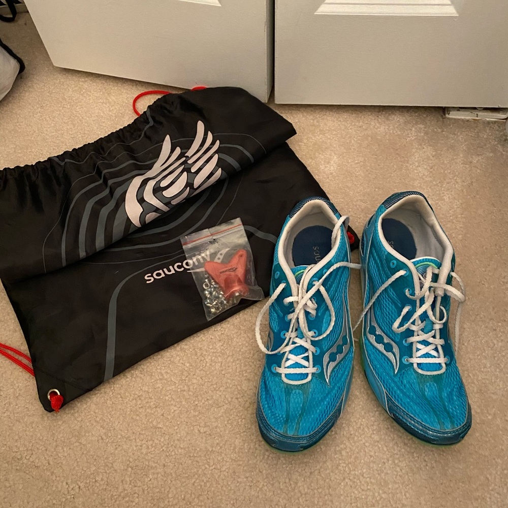 Saucony track spikes with spikes and bag